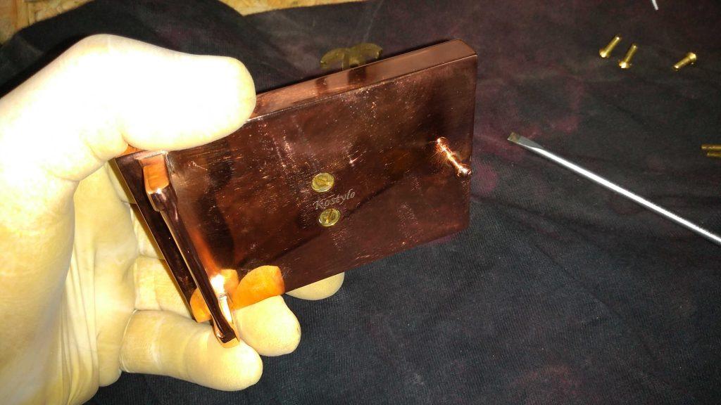 how_we_create_luxurious_belt_buckle_copper_plated_buckle_prior_to_gilding_with_italian_gold_hand_crafted_by_kostylo_atelier the back part of the trouser buckle is copper-plated and polished to high gloss before gilding, hand-engraved with the Kostylo logo in the middle