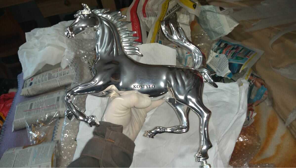 how_we_create_luxury_sculpture_of_ferrari_horse_the_silver_plated_horse_figure_is_ready_for_assembly_at_the_kostylo_atelier the luxury sculpture of the Ferrari horse has already been silver-plated and is waiting for final assembly with the base in the shape of the emblem and with unique striped flint, all handcrafted at the Kostylo atelier
