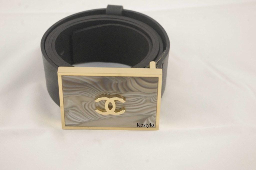 how_we_create_luxury_trouser_buckle_belt_studded_with_striped_flint_handmade_in_the_kostylo_atelier the final result of the handcrafted work at the Kostylo atelier is luxurious belt buckle, gilded with italian gold and featuring the coco chanel logo. The buckle is inlaid with rare striped flint, known as the stone of optimism