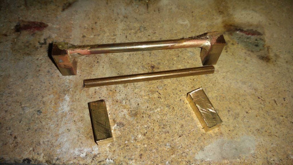how_we_create_soldered_back_piece_to_attach_leather_belt_hand_crafted_by_kostylo_atelier soldered with silver even before grinding the components for the back side of the belt buckle to secure natural black leather belt are handcrafted in the Kostylo atelier
