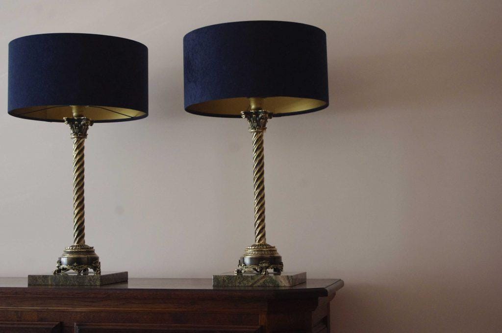 Beautiful, unique, original pair of brass lamps antiqued to bronze, set on elegant green marble, for any luxurious and stylish interior, designed and handcrafted by Kostylo atelier