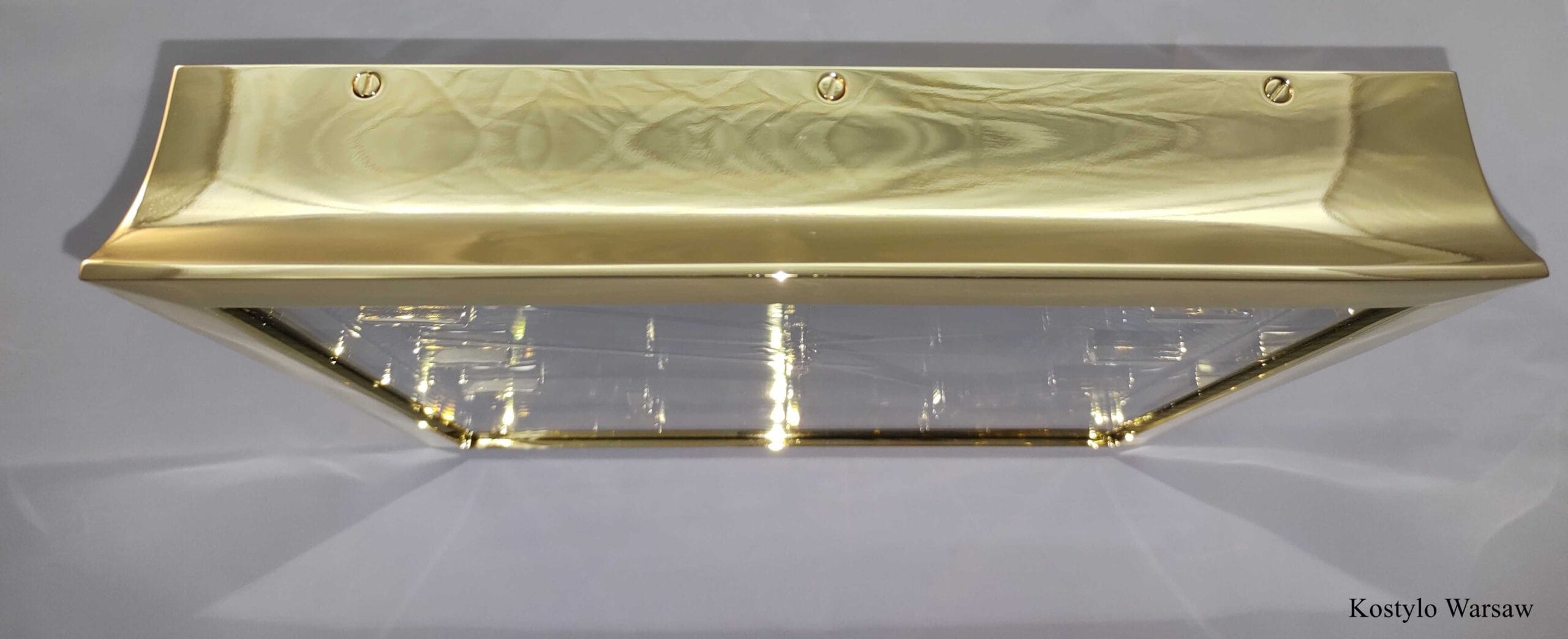 Viewed from the top, a highly luxurious hanging wall clock, gold-plated with genuine 23-karat gold, meticulously handmade with a back closed by gilded screws, the epitome of luxury by kostylo atelier