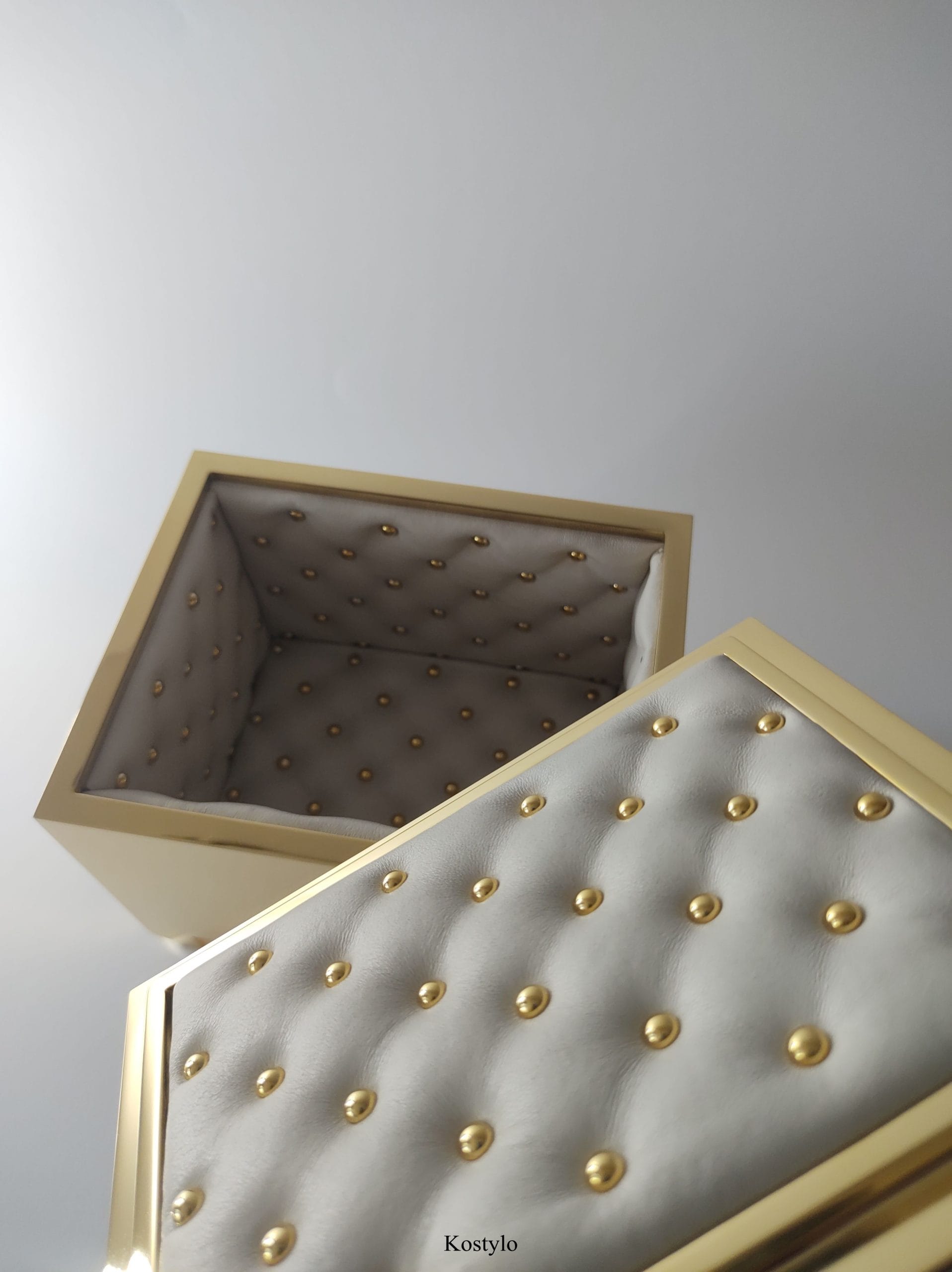 beautiful interior of luxury gold plated box with quilted leather lining, handcrafted with 23-karat gold by kostylo atelier