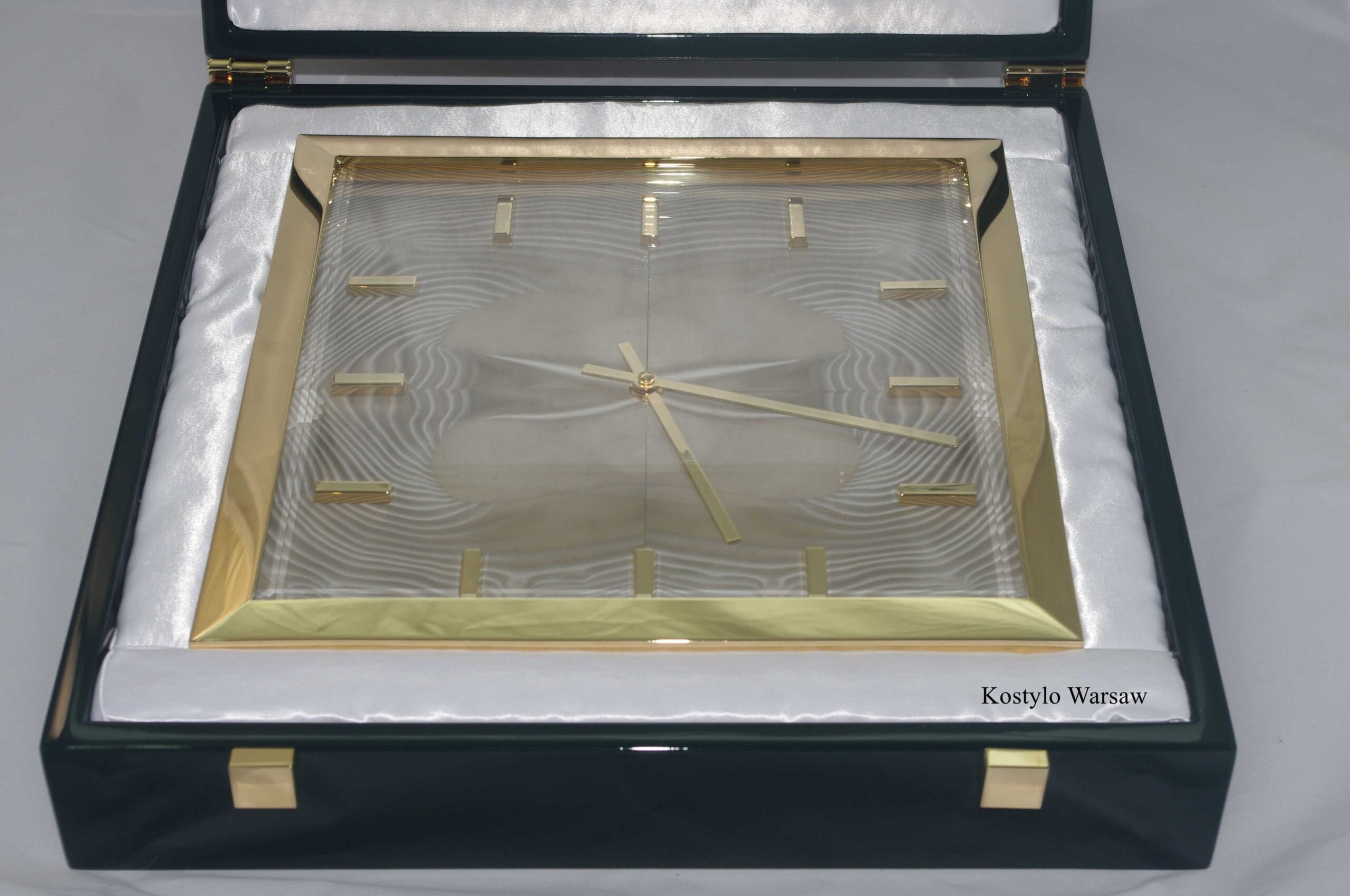 unique luxurious gilded and modern hanging wall clock made of unique striped flint stone tempered and milled glass by kostylo atelier