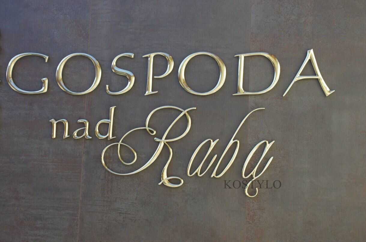 original unusual letters made of solid brass as company inscription polished to high gloss handcrafted by Kostylo atelier