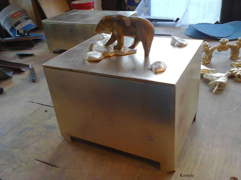 Hand Grinding Copper to Prepare a Casket for Gilding – Kostylo Warsaw atelier Brass box with hand-smoothed surfaces polished with sandpaper, featuring an adjustable polar bear figurine by Kostylo atelier